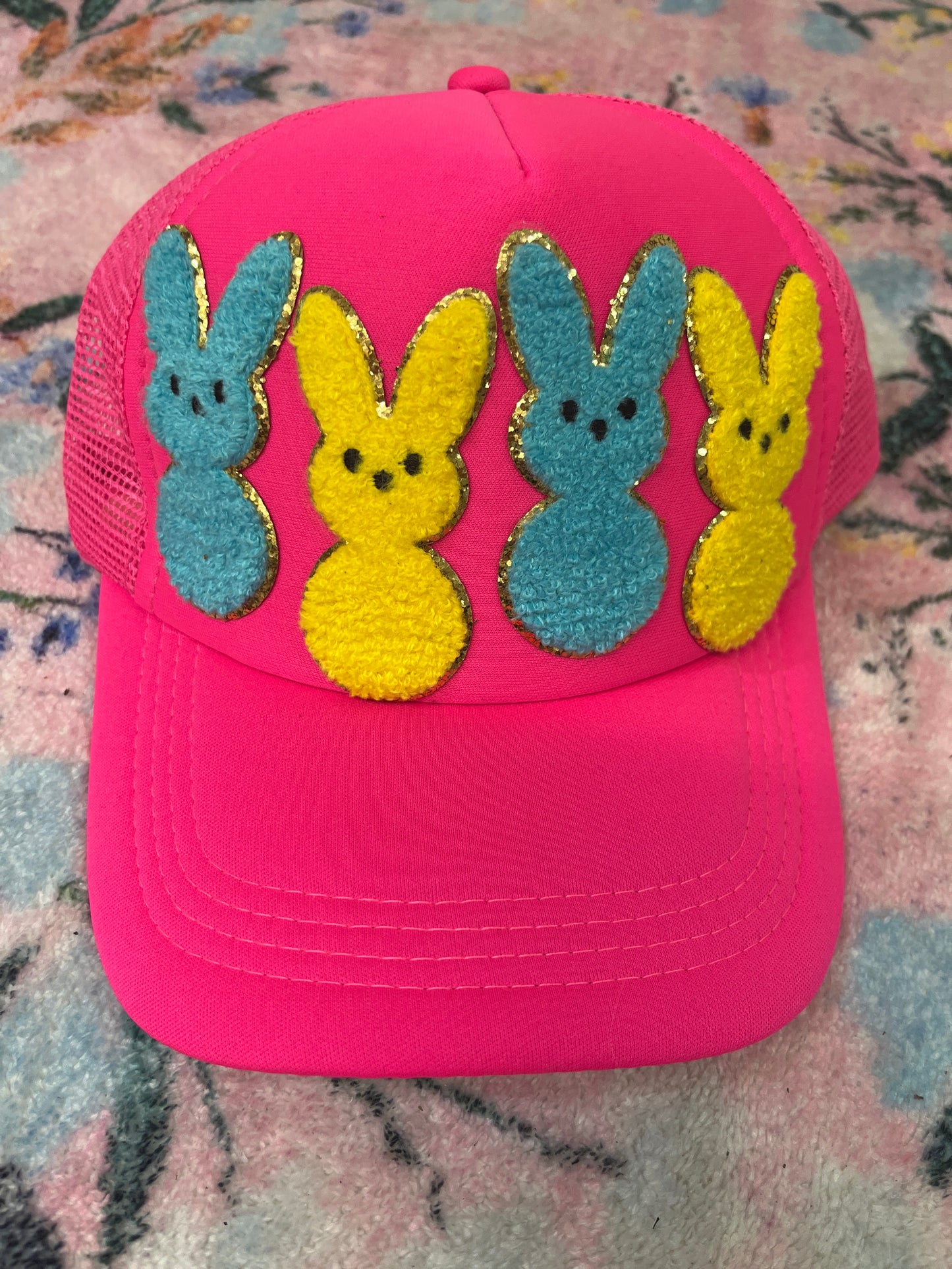 Oopsie blue and pink bunny trucker hat