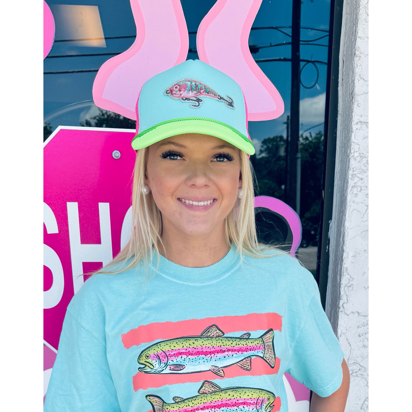 Neon fishing lure trucker hat