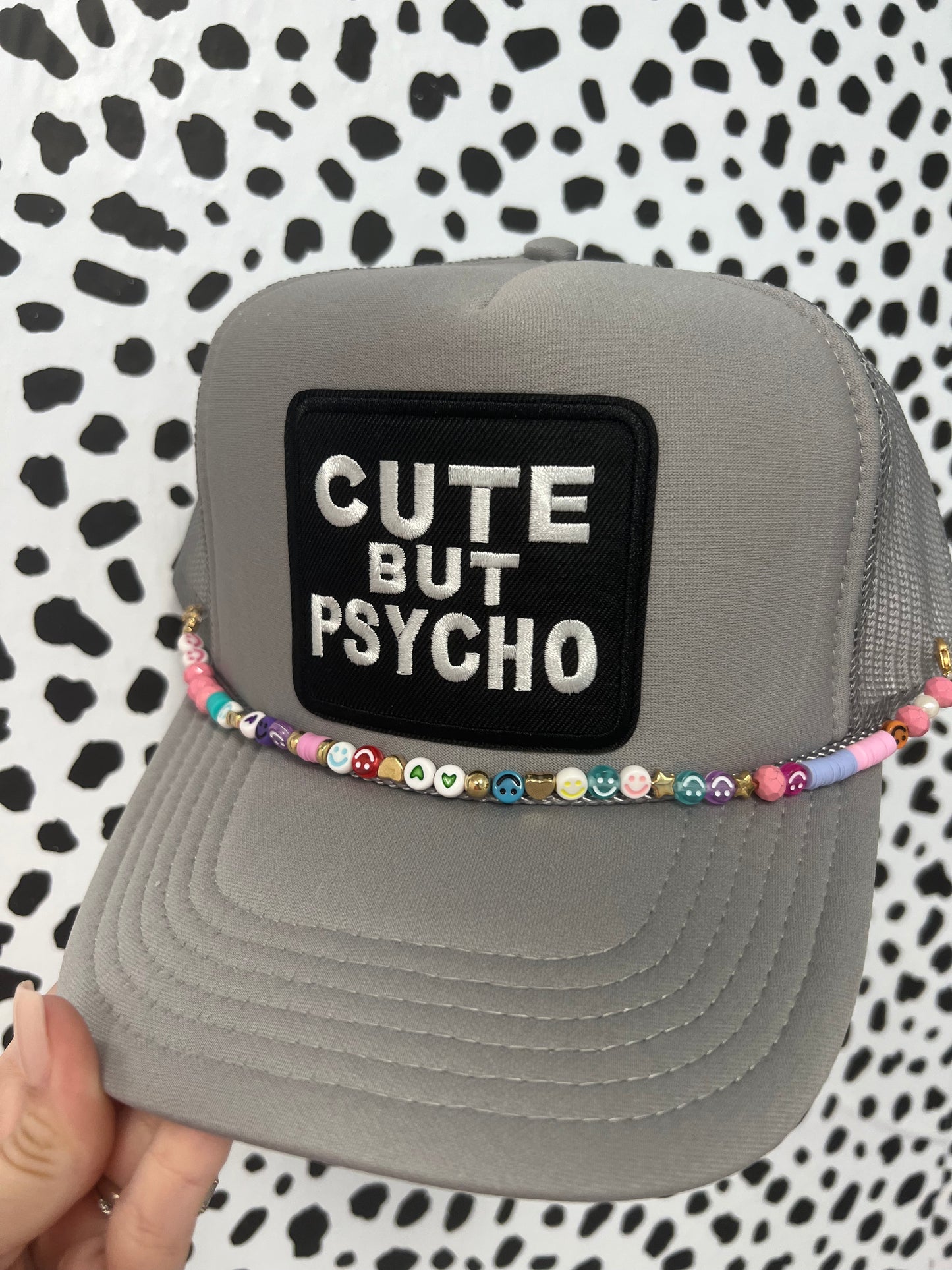 Cute but psycho trucker hat with hat charm