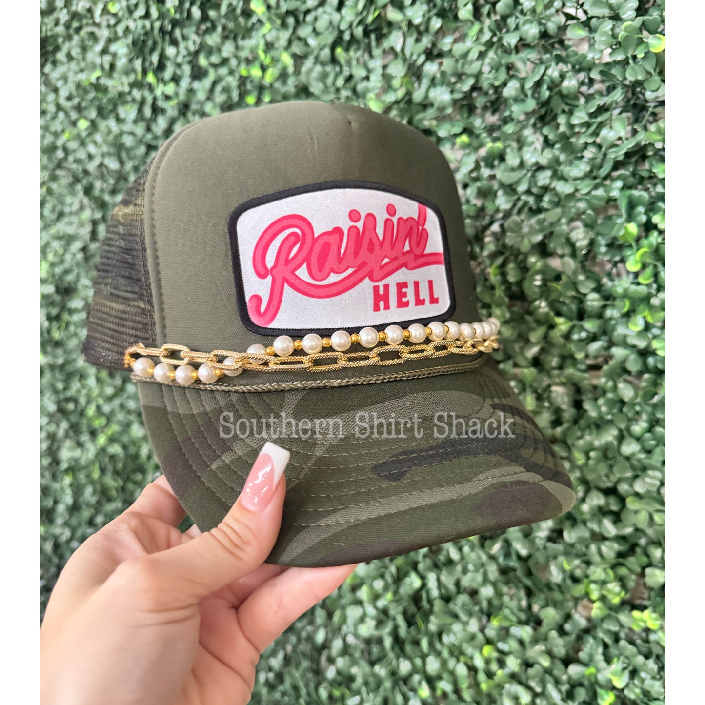 Raisin’ Hell Camo Trucker Hat