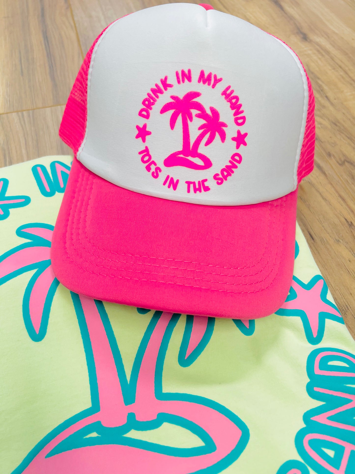 Drink in my hand, toes in the sand trucker hat