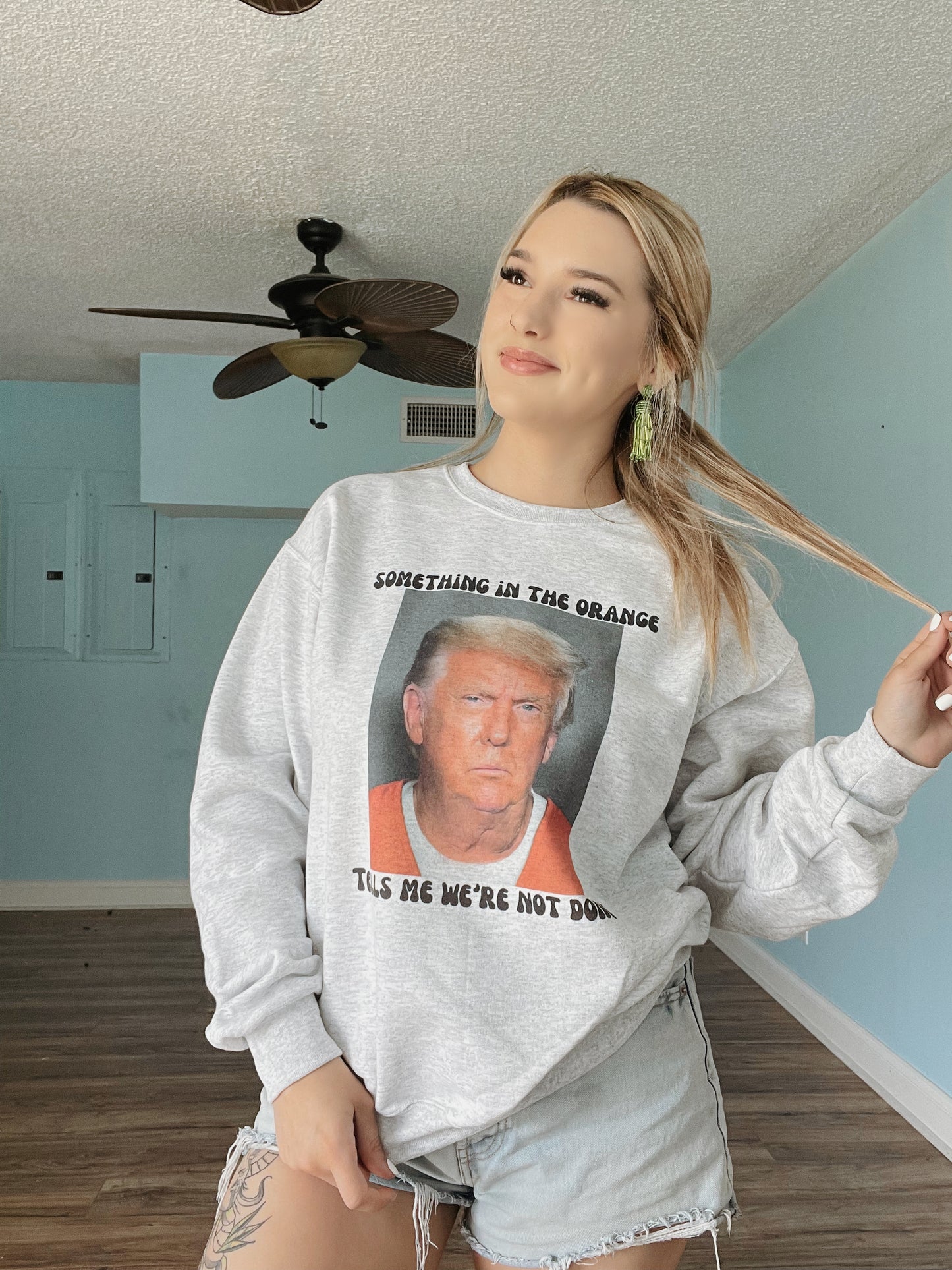 Something in the orange tells me we’re not done | Trump Mugshot Sweatshirt